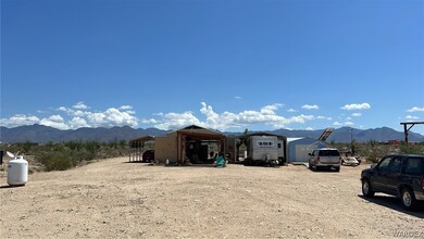 Left To Right; Carport, Open Home Space With Deck,