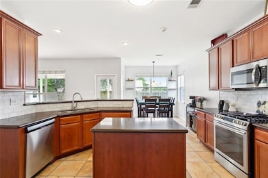 Kitchen with granite and stainless steel appliance