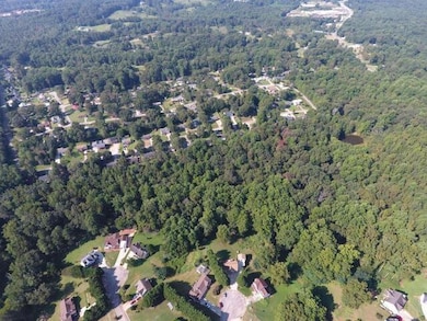 Aerial view of property and surrounding area with 