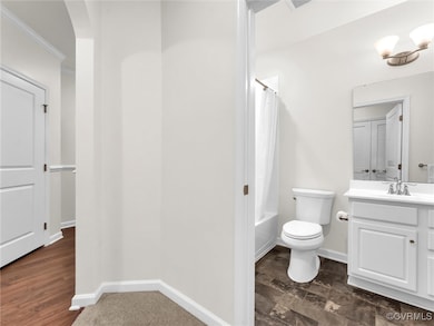 Full bathroom featuring vanity, toilet, and shower