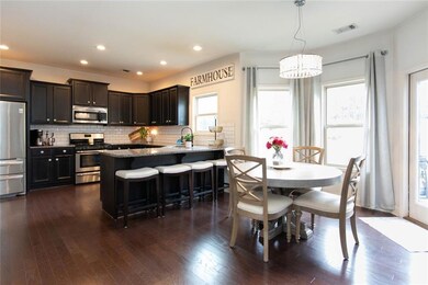 Kitchen featuring tasteful backsplash, visible ven
