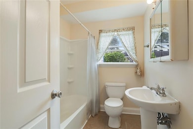 Well appointed bathroom with a window that brings