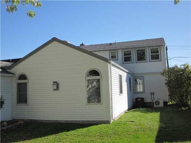 Exterior Back. Expanded dormer upstairs and large 