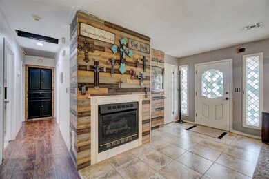 Entryway with wood walls and light wood-type floor