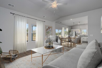 Living room with visible vents, vaulted ceiling, a