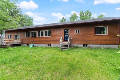 Back of house with a wooden deck