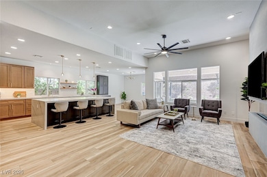 Living area with light wood-style flooring, recess