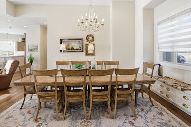 Dining room featuring a chandelier, light wood finished floors, and recessed lighting