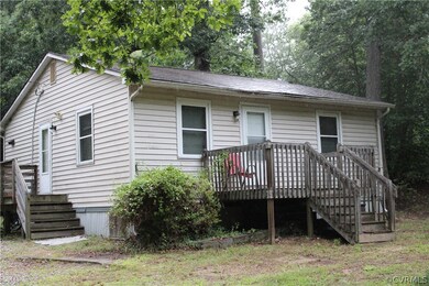 View of front of home with a wooden deck