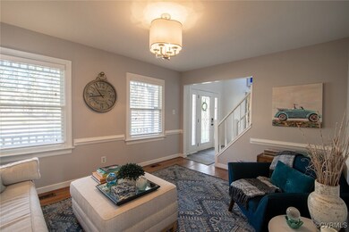 Living room featuring wood finished floors, visibl