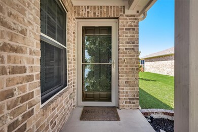 Property entrance with a lawn