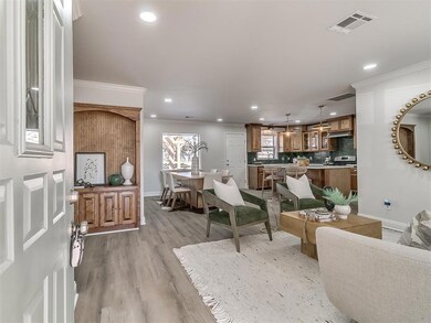 Living room with light hardwood / wood-style floor