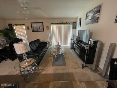 Living room featuring ceiling fan