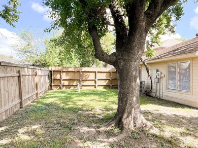 Back yard with nice shade tree