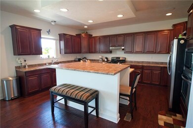 Over sized kitchen with upgraded cabinets and coun