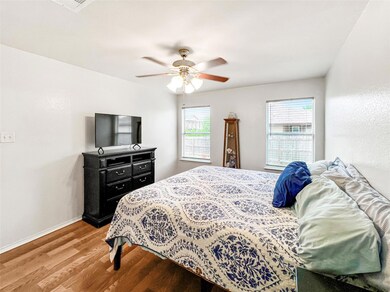 Bedroom featuring light wood-style flooring, a ce