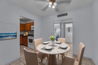 Dining Room with overhead ceiling fan with lightin