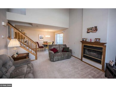Main level living room with vaulted ceilings and g