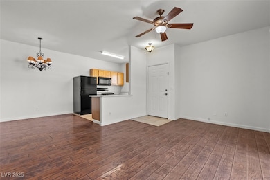 Unfurnished living room with baseboards, ceiling f