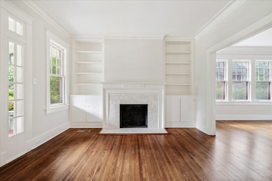 Unfurnished living room with dark hardwood / wood-
