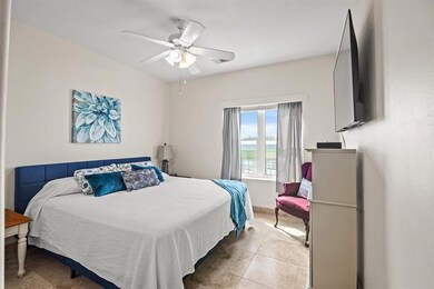 Primary bedroom with ocean view..