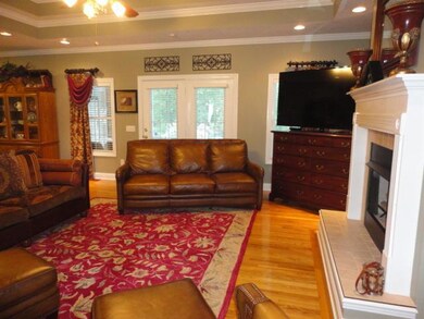 Another view of the living room with views out to the pool and the Florida room.