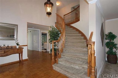 Curved staircase leads to Master and 4 bedrooms up