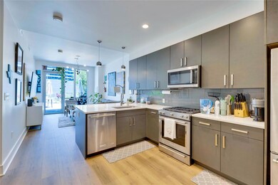 Kitchen with stainless steel appliances, a penins