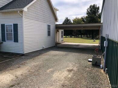 COVERED BREEZEWAY BETWEEN HOUSE AND SHOP