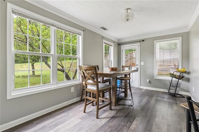 Dining room with a healthy amount of sunlight, vis
