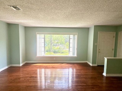 Unfurnished room featuring wood finished floors, 