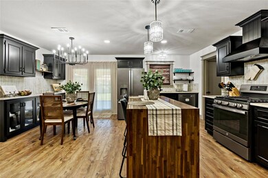 Kitchen with stainless steel appliances, an inviti