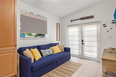 Living room featuring light tile patterned floors