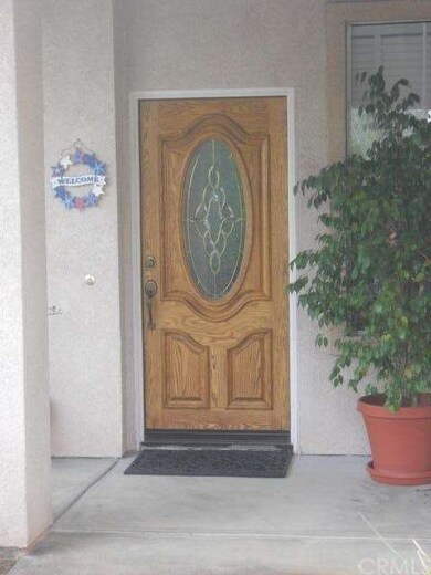 BEVELED GLASS INSERT IN FRONT DOOR.