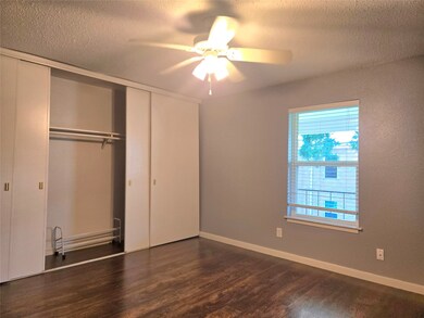 Bright bedroom featuring hardwood floors, a ceilin