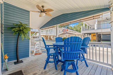 Wooden deck featuring ceiling fan