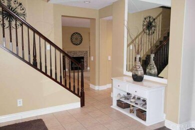 Inviting entry with handsome tile flooring and war