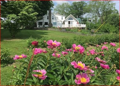 Established gardens surround the home, adding to t