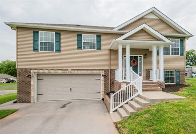 The Frontal view shows the 25x20 double garage and extra parking for at least 2 cars!