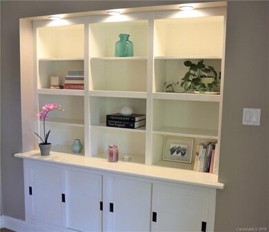Custom built in shelves with lots of storage.