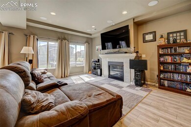 Living room with light hardwood / wood-style floor