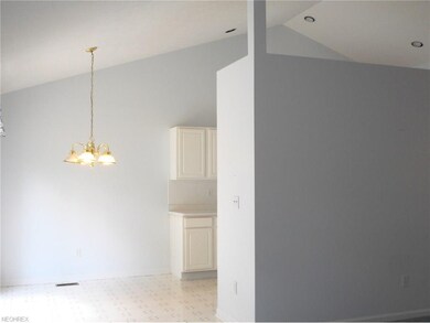 The kitchen, dining and living room is a large vau