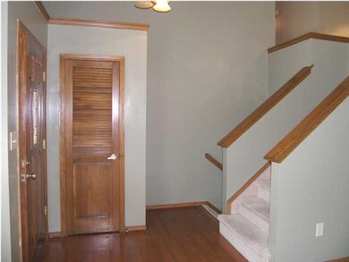 Entry foyer features beautiful wood floor and offe