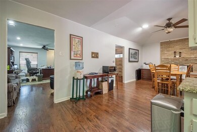 Kitchen and den looking into living area