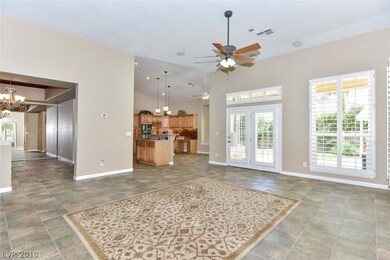 VIEW OF FORMAL DINING ROOM, LARGE FAMILY ROOM AND