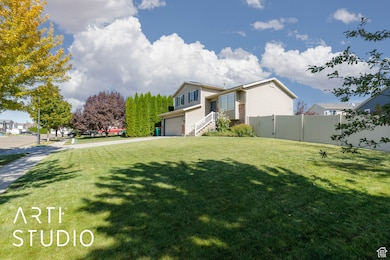 View of front of house with driveway and an attached garage