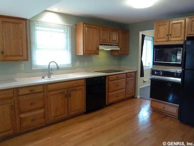 Kitchen Spacious kitchen features new cooktop, fau