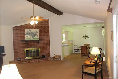 Spacious Great Room with fireplace, lighted ceilin