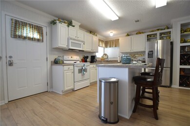 LARGE BRIGHT KITCHEN WITH NICE NEW FLOORS TOO!