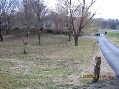 HOMES SETS BACK OFF THE ROAD AND IN THE SPRING AND SUMMER IT IS BEAUTIFUL WITH ALL THE TREES BLOOMED OUT......LOTS OF PRIVACY....